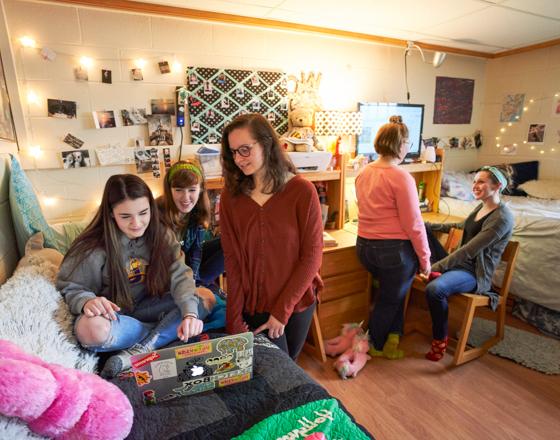 Group of female students in a residence hall room